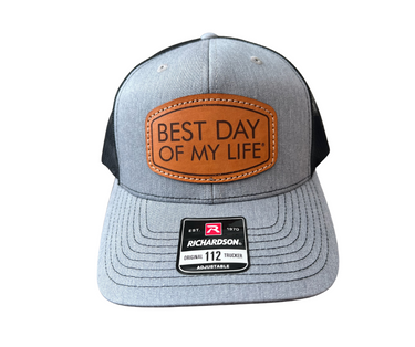 Gray and black cap with leather patch 'Best Day of My Life' on a white background